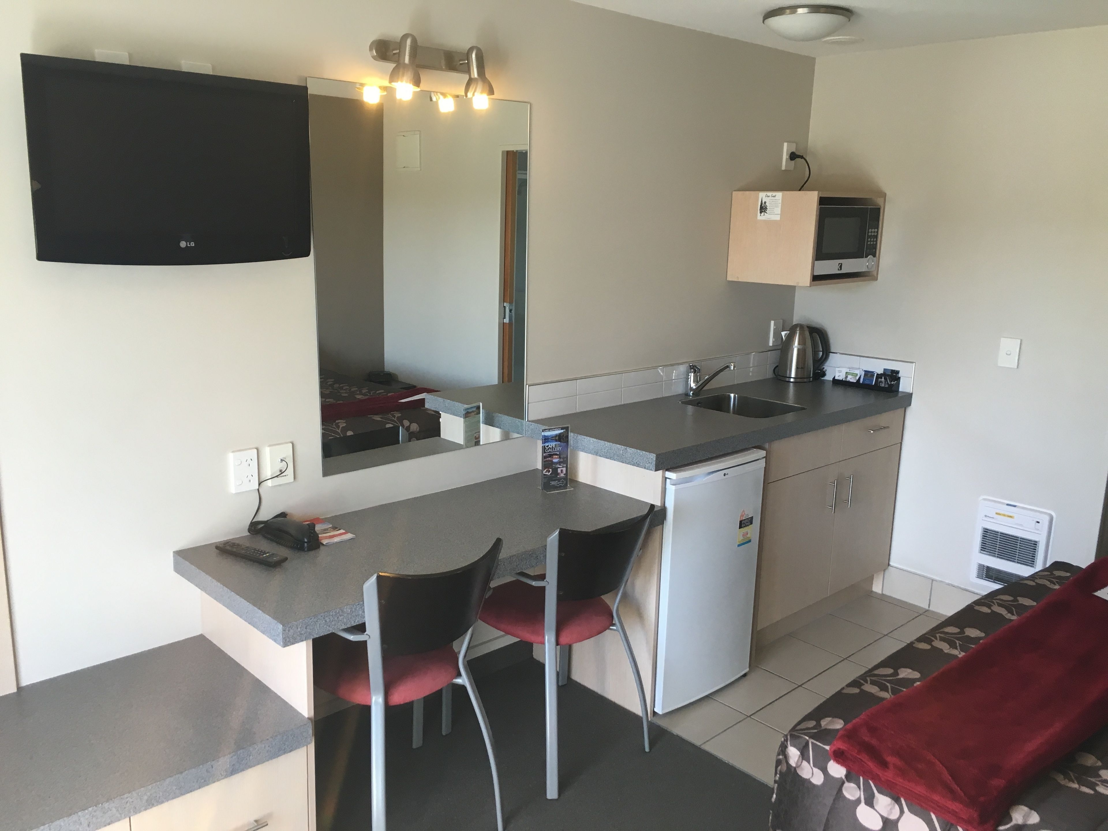 Superior Queen Studio | Desk, blackout drapes, soundproofing, iron/ironing board