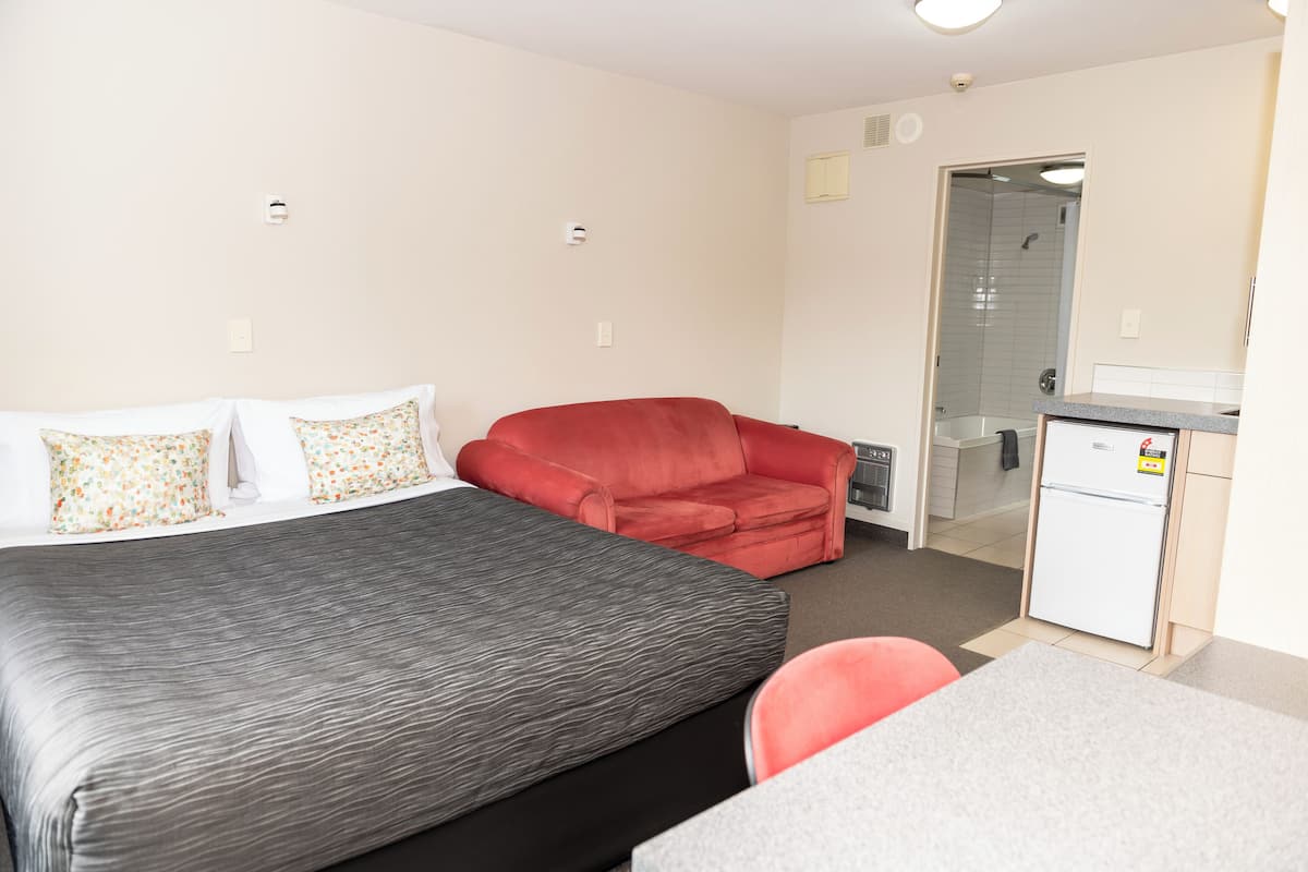 Superior King Studio | Desk, blackout curtains, soundproofing, iron/ironing board