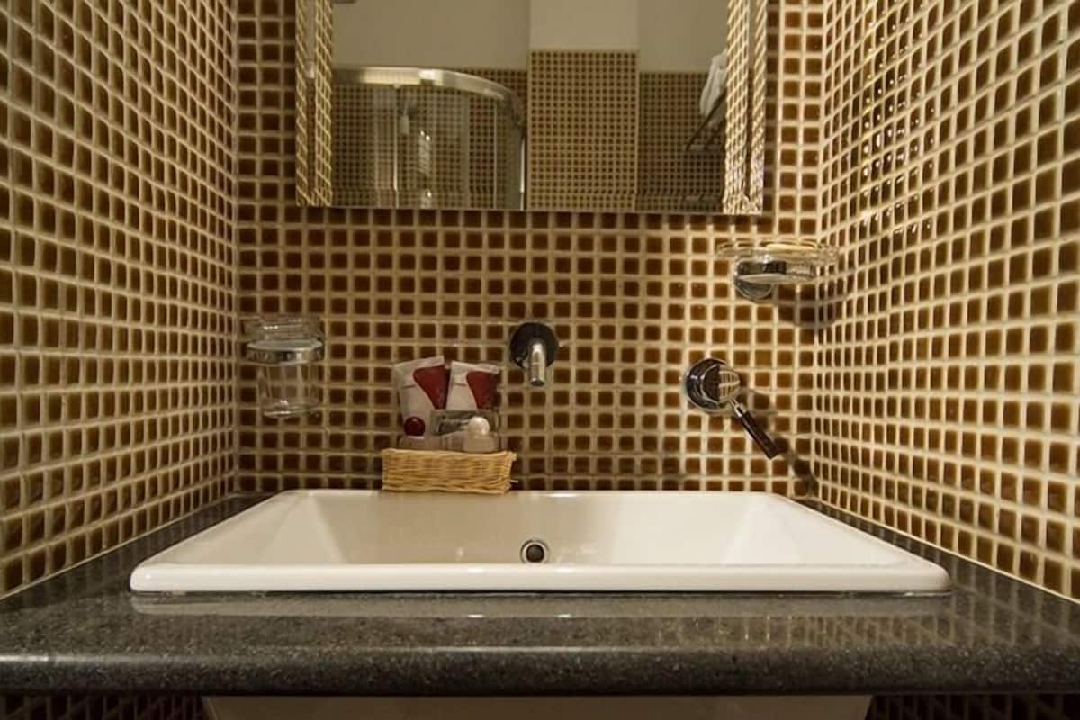 junior suite, 1 bedroom, balcony | bathroom | shower, free toiletries, hair dryer, towels