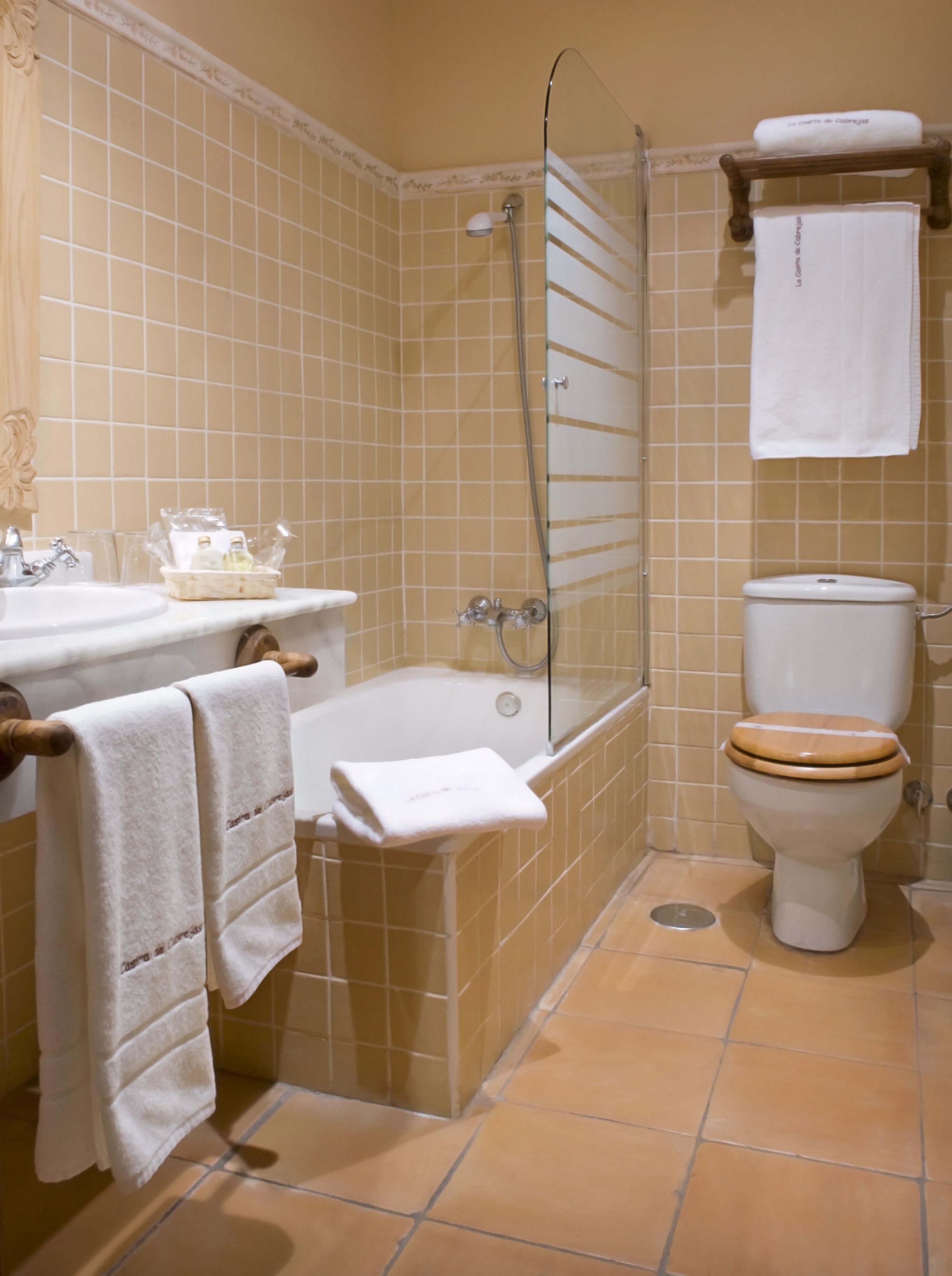 A bathroom with a bathtub, a toilet, and a shower.