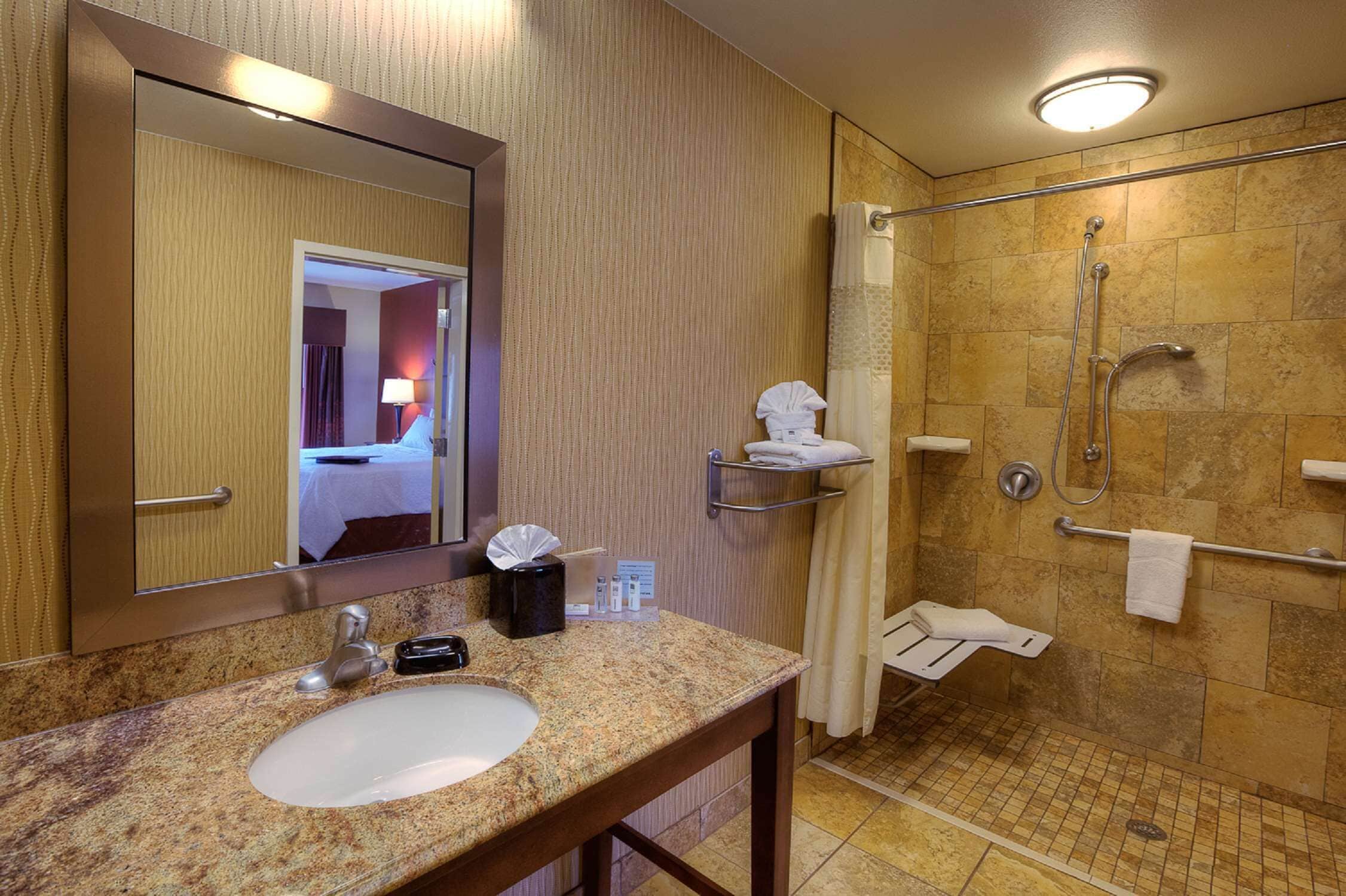 suite, 1 king bed, accessible (mobility & hearing, roll-in shower) | bathroom | shower, free toiletries, hair dryer, towels