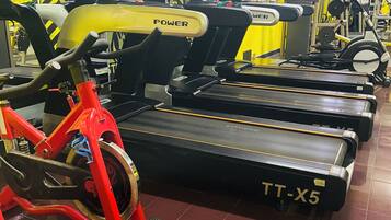 A gym with stationary bikes and treadmills.