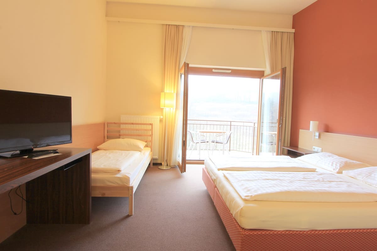 superior triple room | minibar, in-room safe, desk, blackout curtains