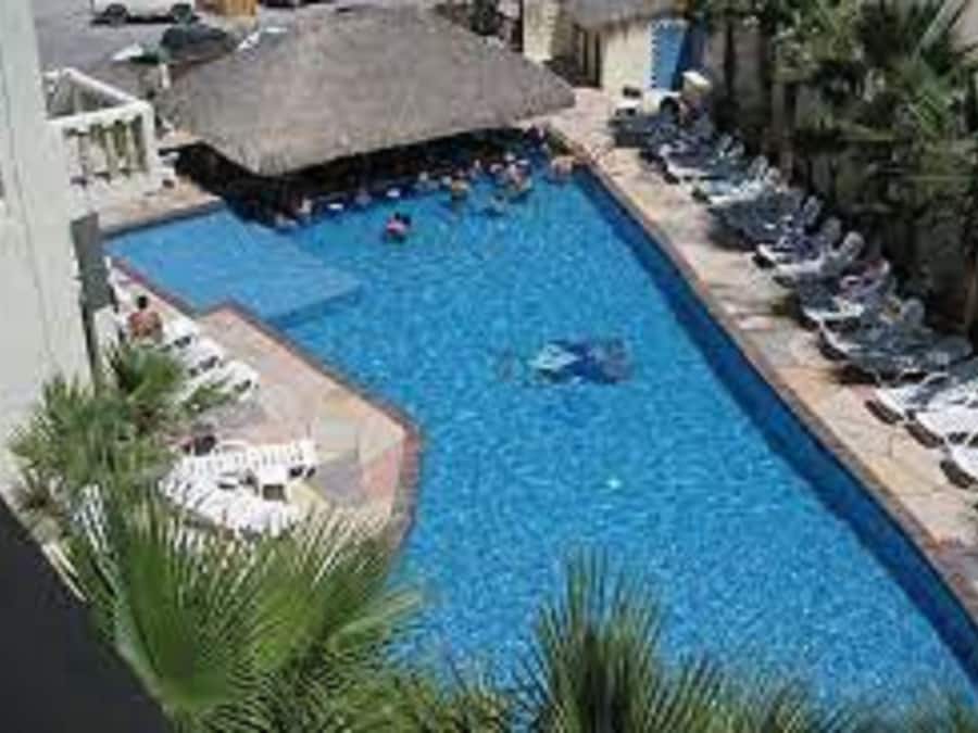 Outdoor pool, open 8:00 AM to 10:00 PM, free cabanas