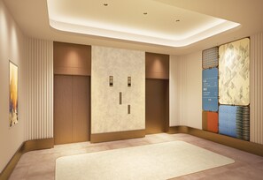 A hotel lobby with a reception desk, a wall-mounted information board, and a large abstract artwork. - Citadines North Shinjuku Tokyo (Tokyo)