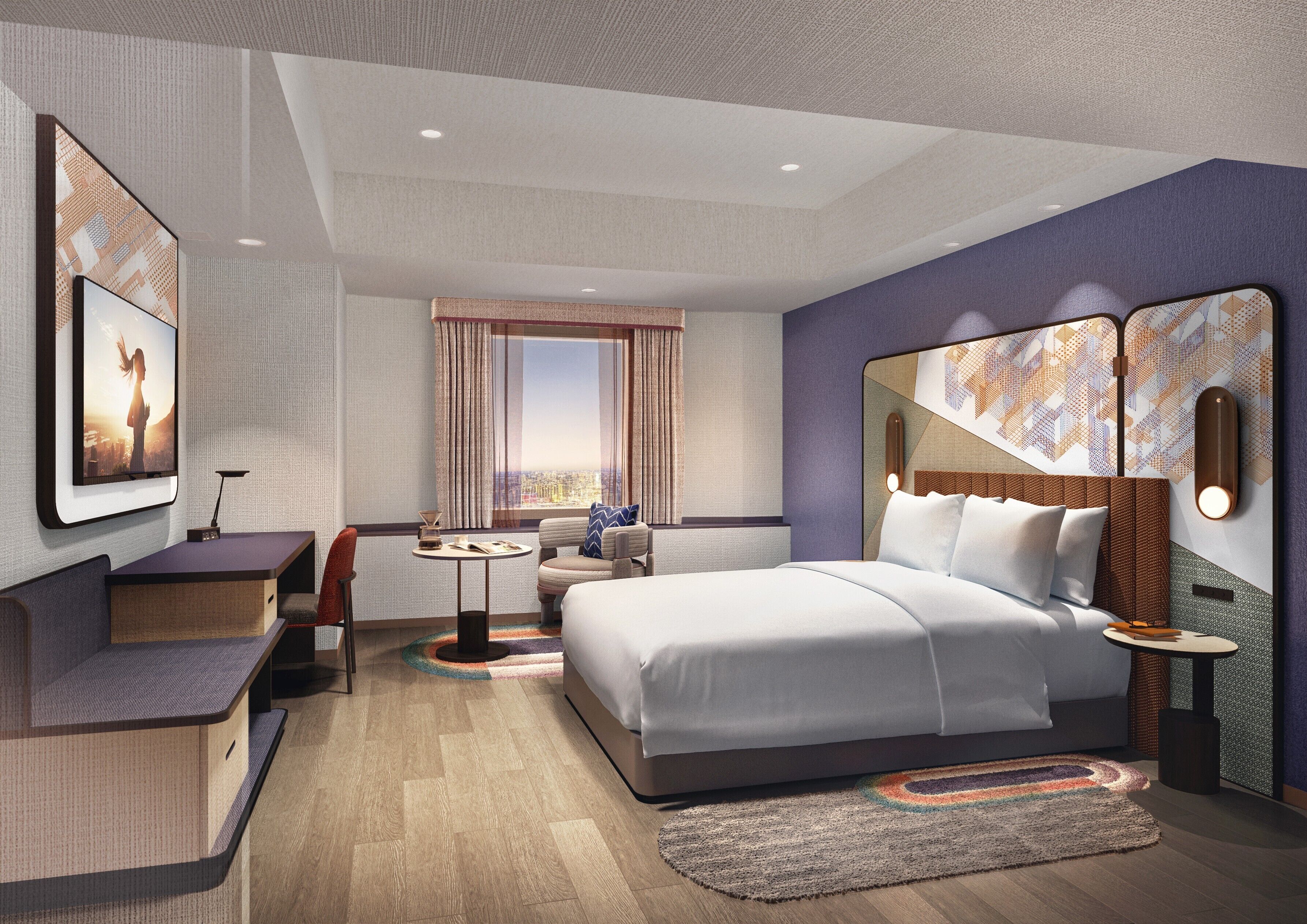 Habitación de hotel moderna con una cama grande, un escritorio, una zona de estar y vistas a la ciudad.