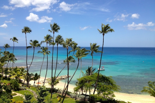 On the beach, white sand, free beach cabanas, sun-loungers
