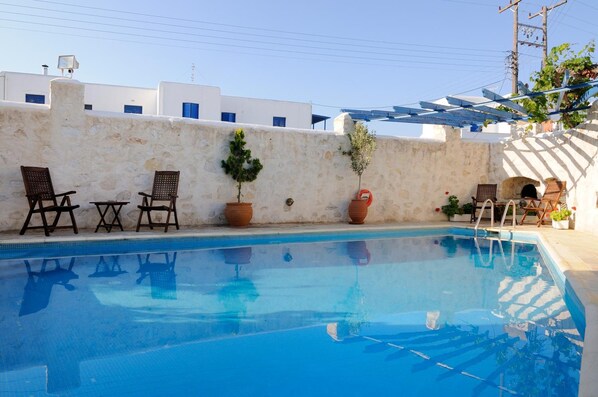 Outdoor pool, open 10 AM to 7 PM, pool umbrellas, pool loungers
