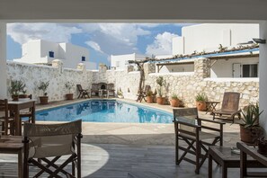 Outdoor pool, open 10 AM to 7 PM, pool umbrellas, pool loungers