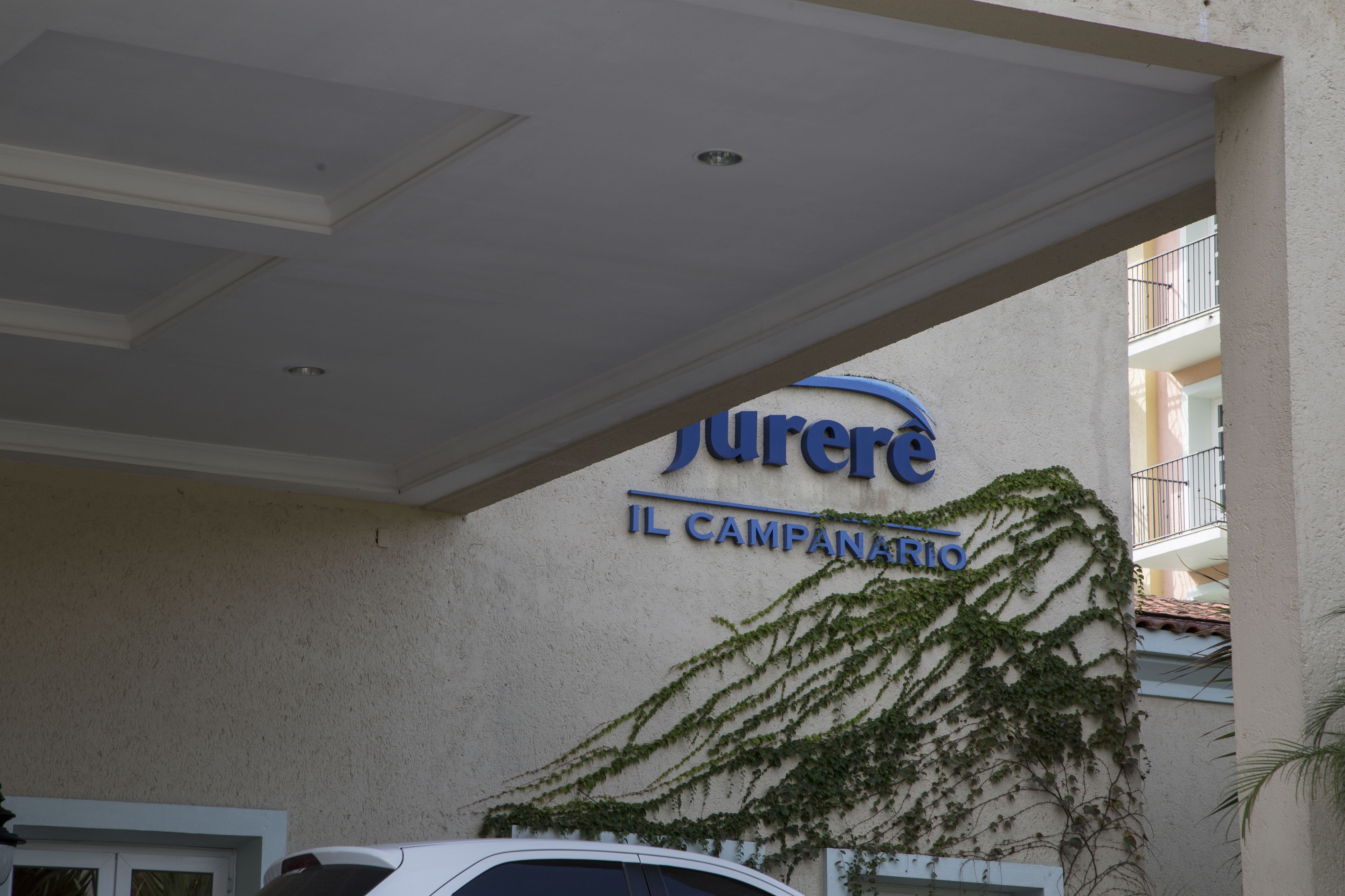 A hotel sign with the name 'Juree' and 'Il Campanario' indicating the hotel's name.