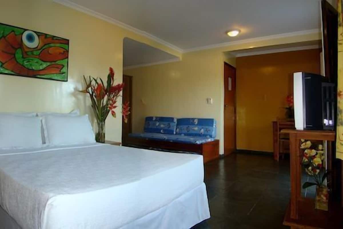 Superior Triple Room | Minibar, in-room safe, desk, blackout drapes