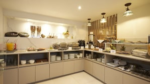 A modern kitchen with various appliances and utensils, including a coffee maker, blender, and food storage containers. - Hotel Saint Simon (Bogotá)