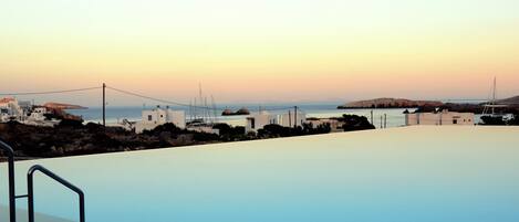 Outdoor pool, open 8:00 AM to 7:30 PM, pool umbrellas, pool loungers