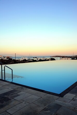 Outdoor pool, open 8:00 AM to 7:30 PM, pool umbrellas, pool loungers