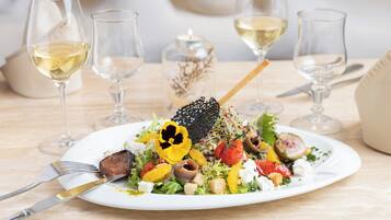 A plate of food with a fork and knife on a table.