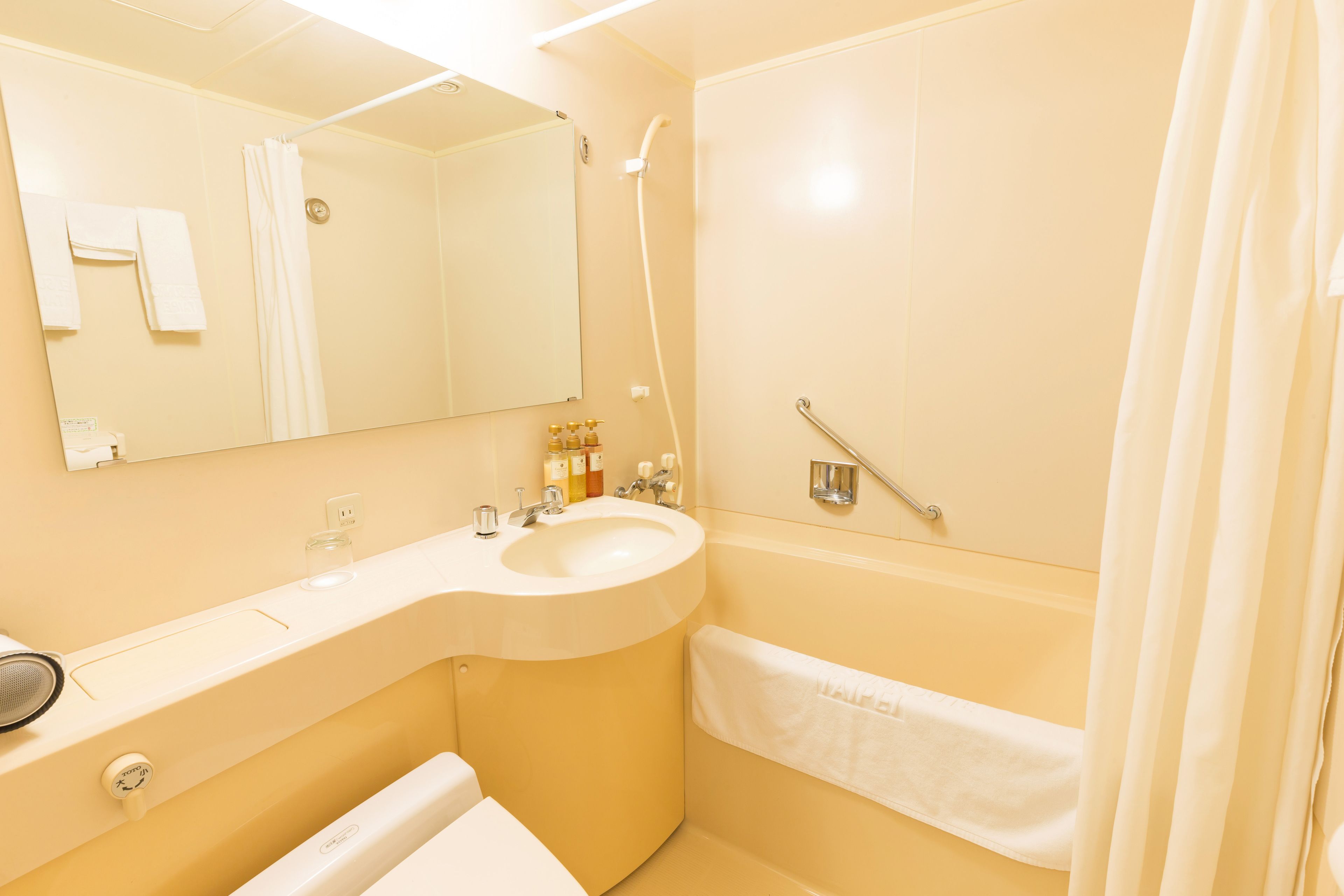 combined shower/bathtub, hair dryer, slippers, electronic bidet