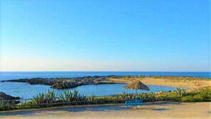 Private beach, white sand, sun-loungers, beach umbrellas