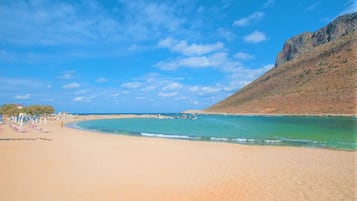 Private beach, white sand, sun-loungers, beach umbrellas