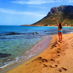 Private beach, white sand, sun loungers, beach umbrellas