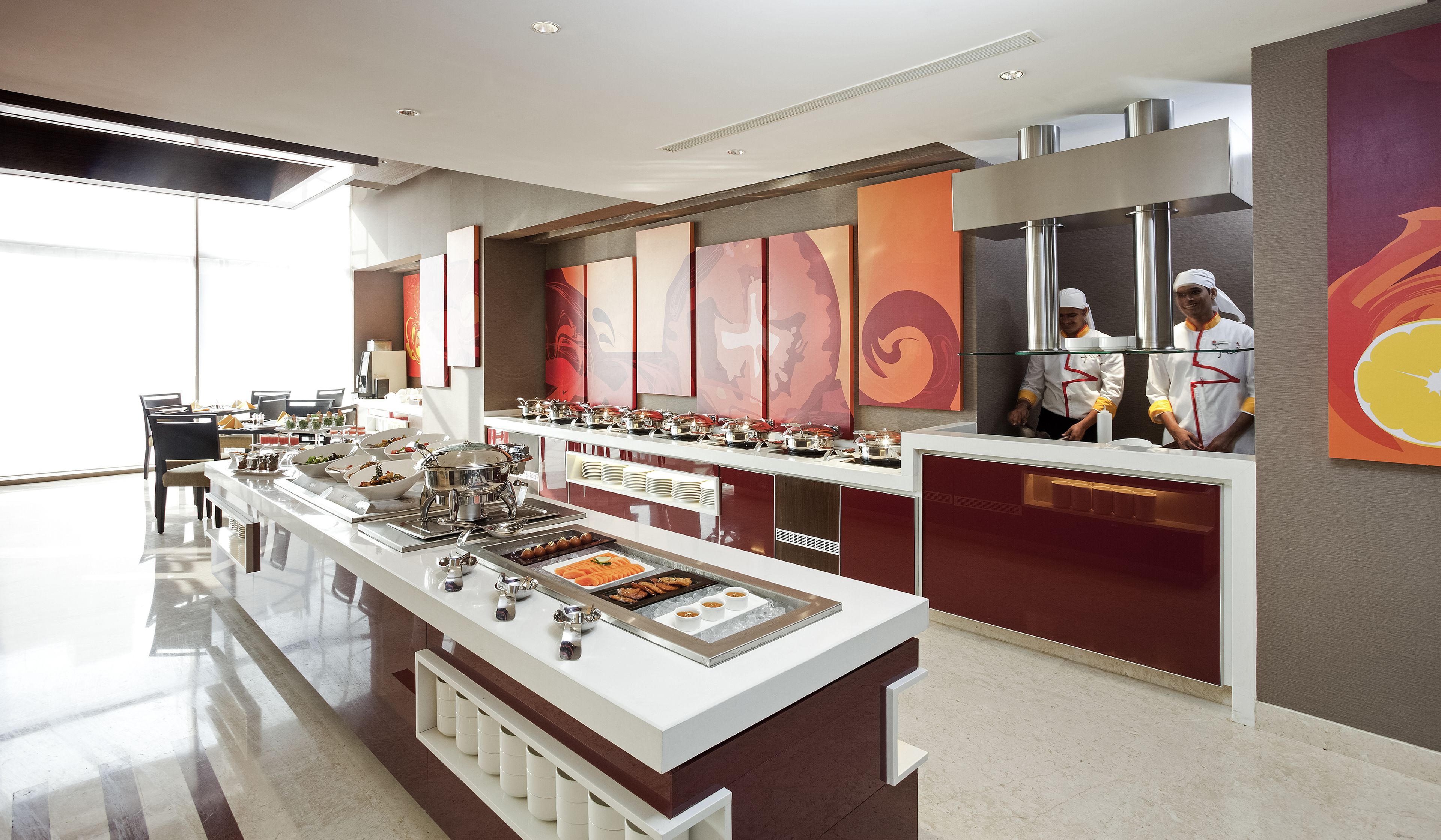 A modern buffet setup with various food stations and a clean, contemporary design.