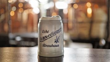 A beer mug with text on it.