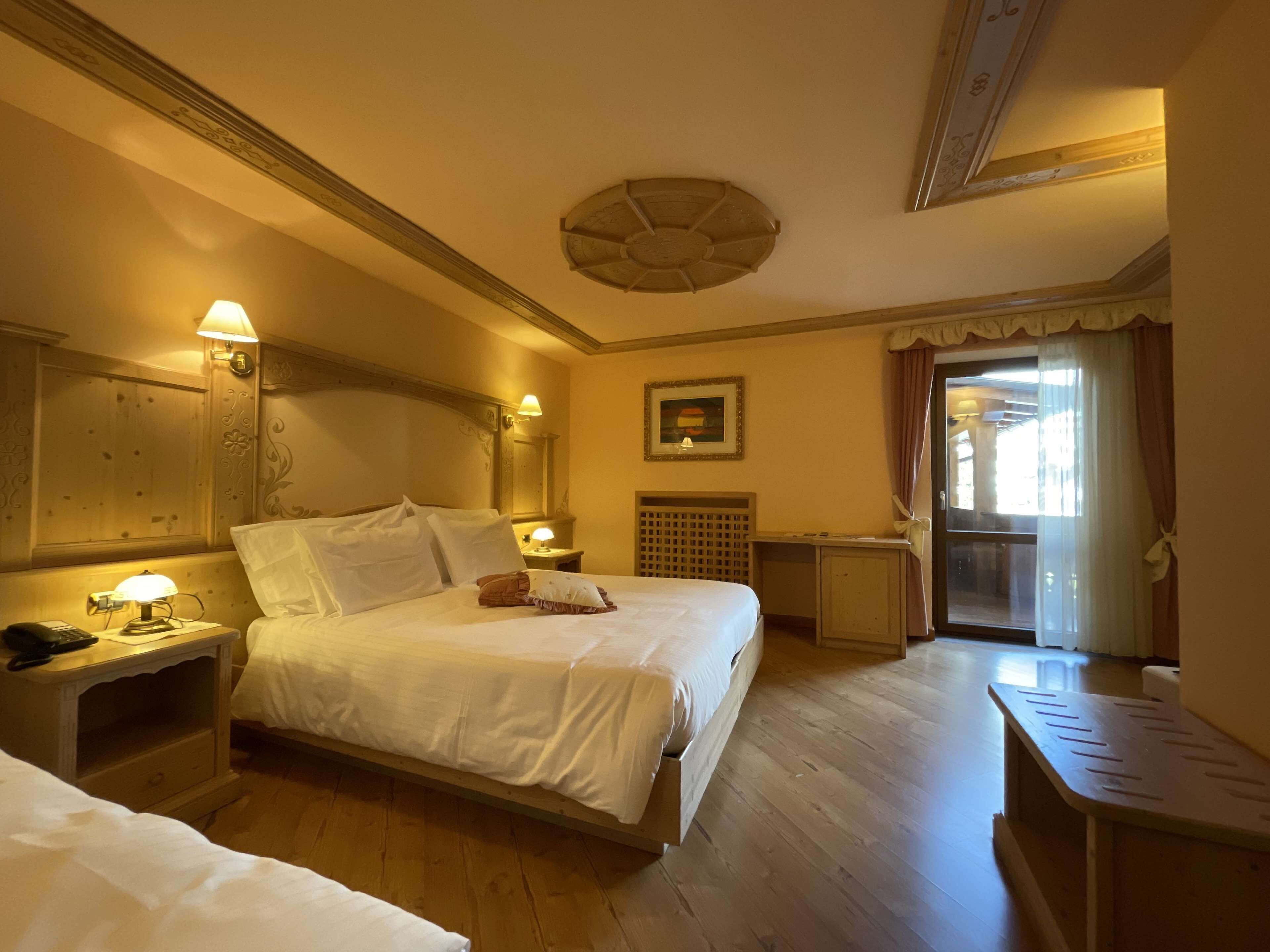comfort room, multiple beds, balcony, mountain view | in-room safe, desk, free wifi, bed sheets