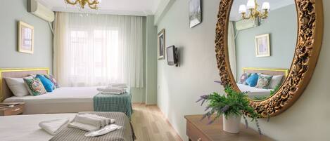 Standard Triple Room, Multiple Beds, Partial Sea View | Room amenity