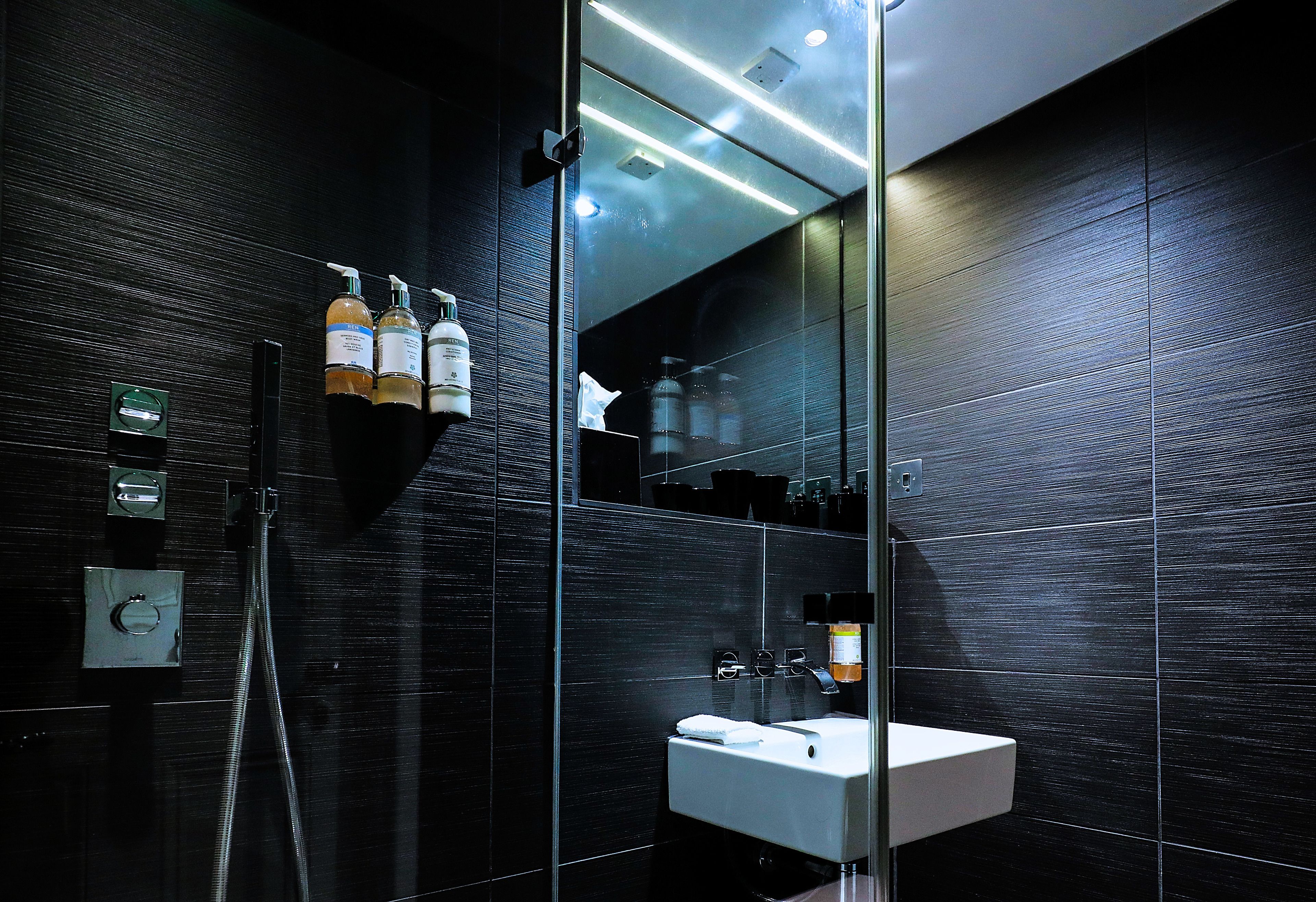 club deluxe twin | bathroom | free toiletries, hair dryer, towels, soap