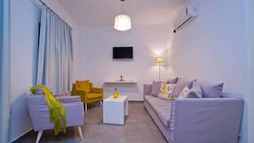 Suite with Caldera View | Living room | 32-inch LED TV with satellite channels, TV