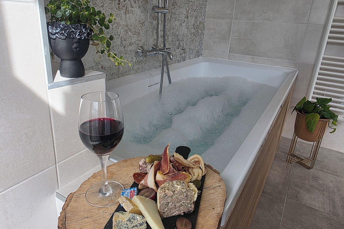 Deluxe Room, Hot Tub, River View | Desk, laptop workspace, soundproofing, iron/ironing board