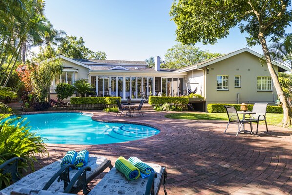 Outdoor pool, pool umbrellas, pool loungers