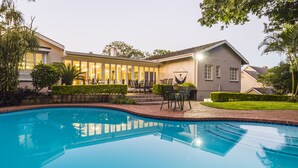 Outdoor pool, pool umbrellas, sun loungers