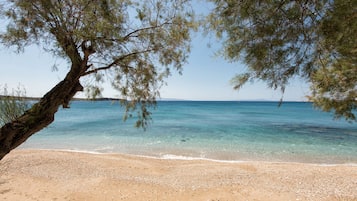On the beach, sun loungers, beach umbrellas, beach towels