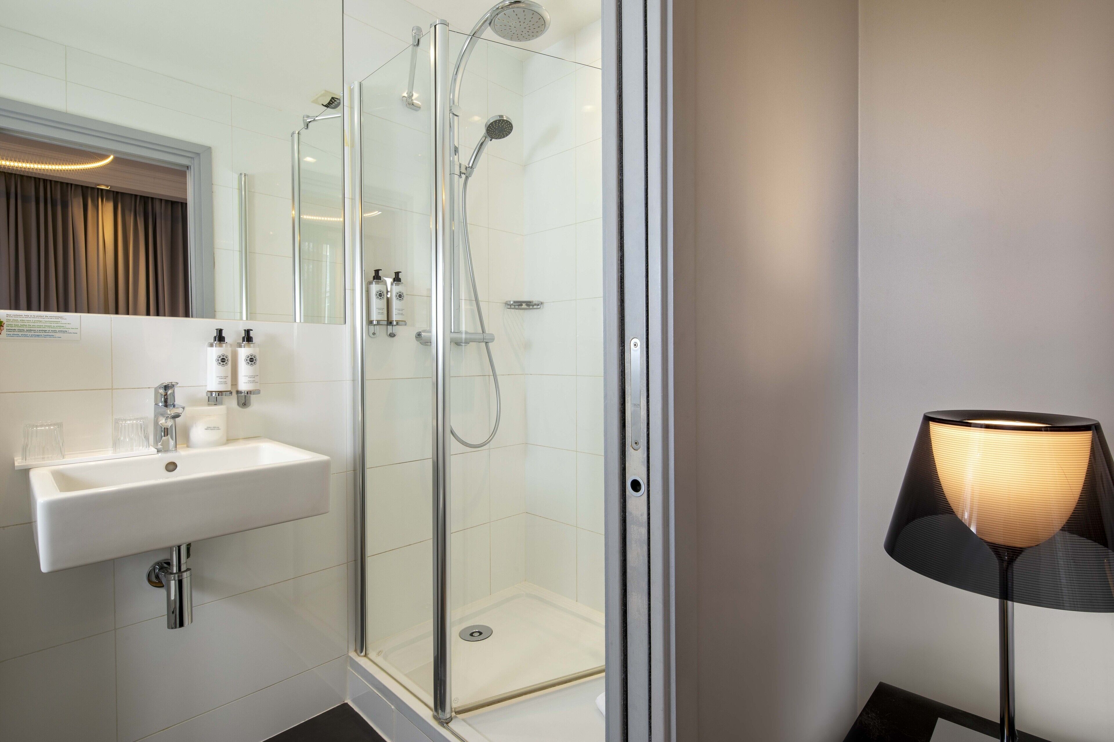 suite cambronne | bathroom | shower, rainfall showerhead, hair dryer, towels