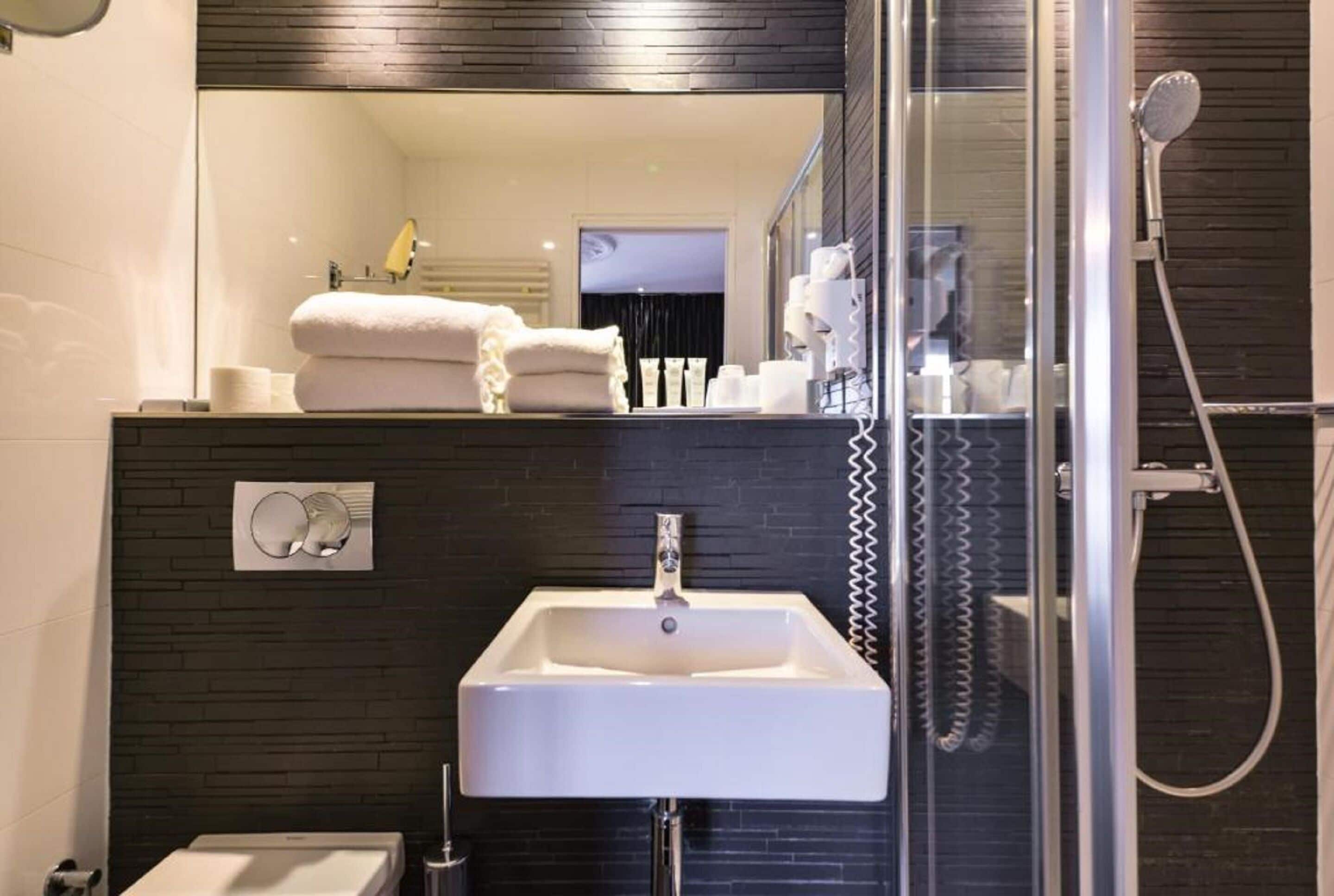classic double room | bathroom | shower, rainfall showerhead, hair dryer, towels