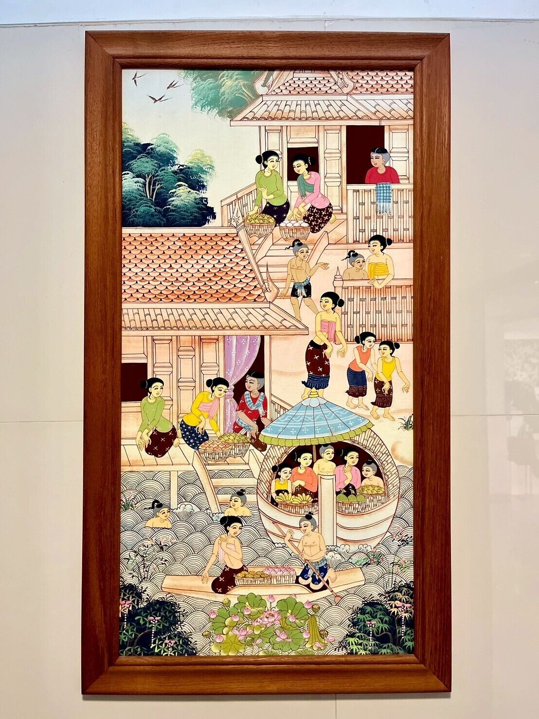 A traditional building with multiple levels, featuring a tiled roof and a central courtyard with a water feature.
