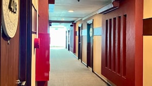 A hotel hallway with doors numbered 403, 404, and 405.