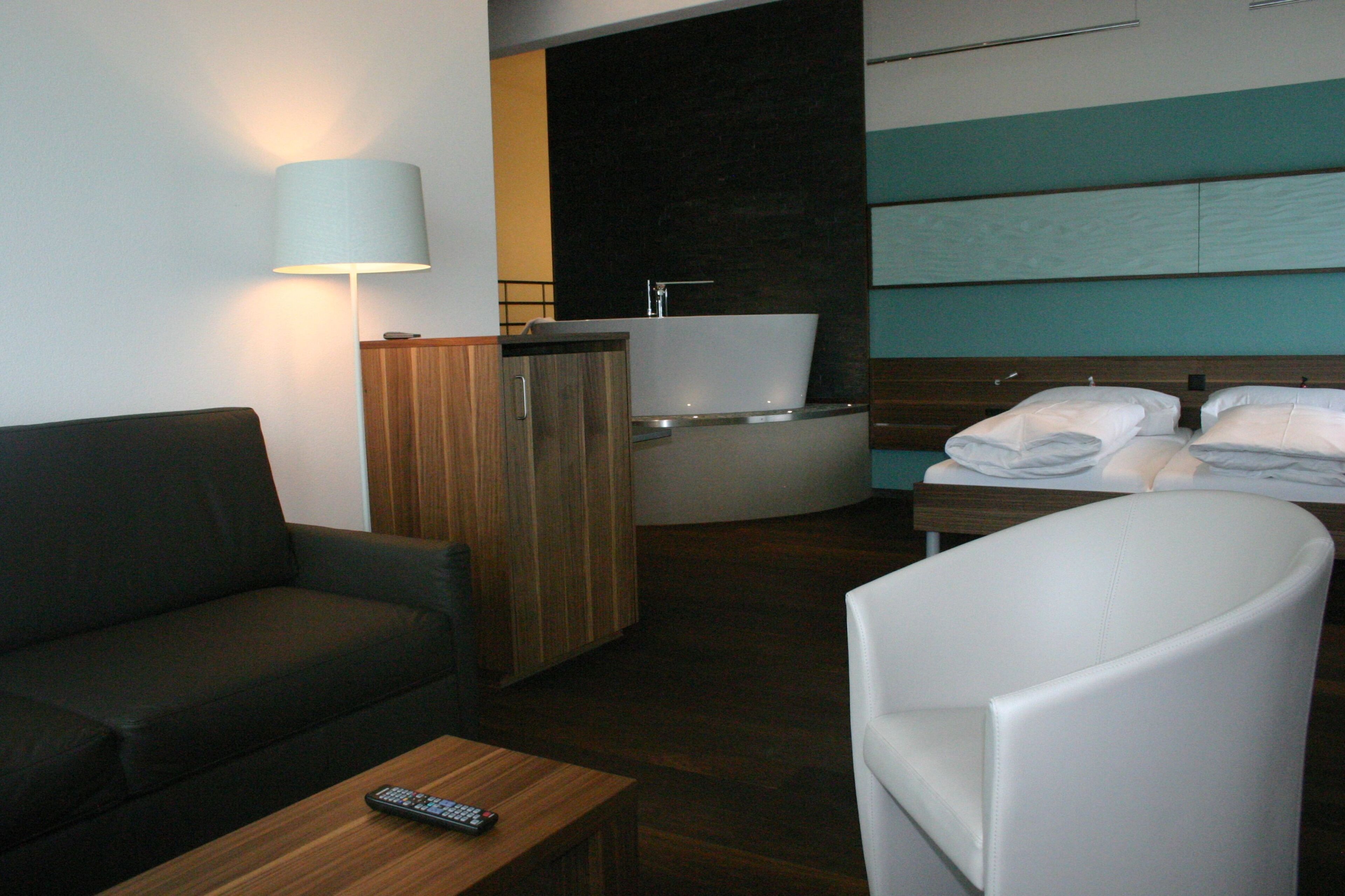 hypo-allergenic bedding, down duvets, in-room safe, desk