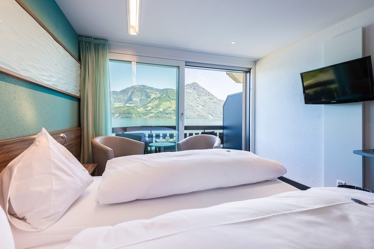 superior double room, lake view | hypo-allergenic bedding, down duvets, in-room safe, desk