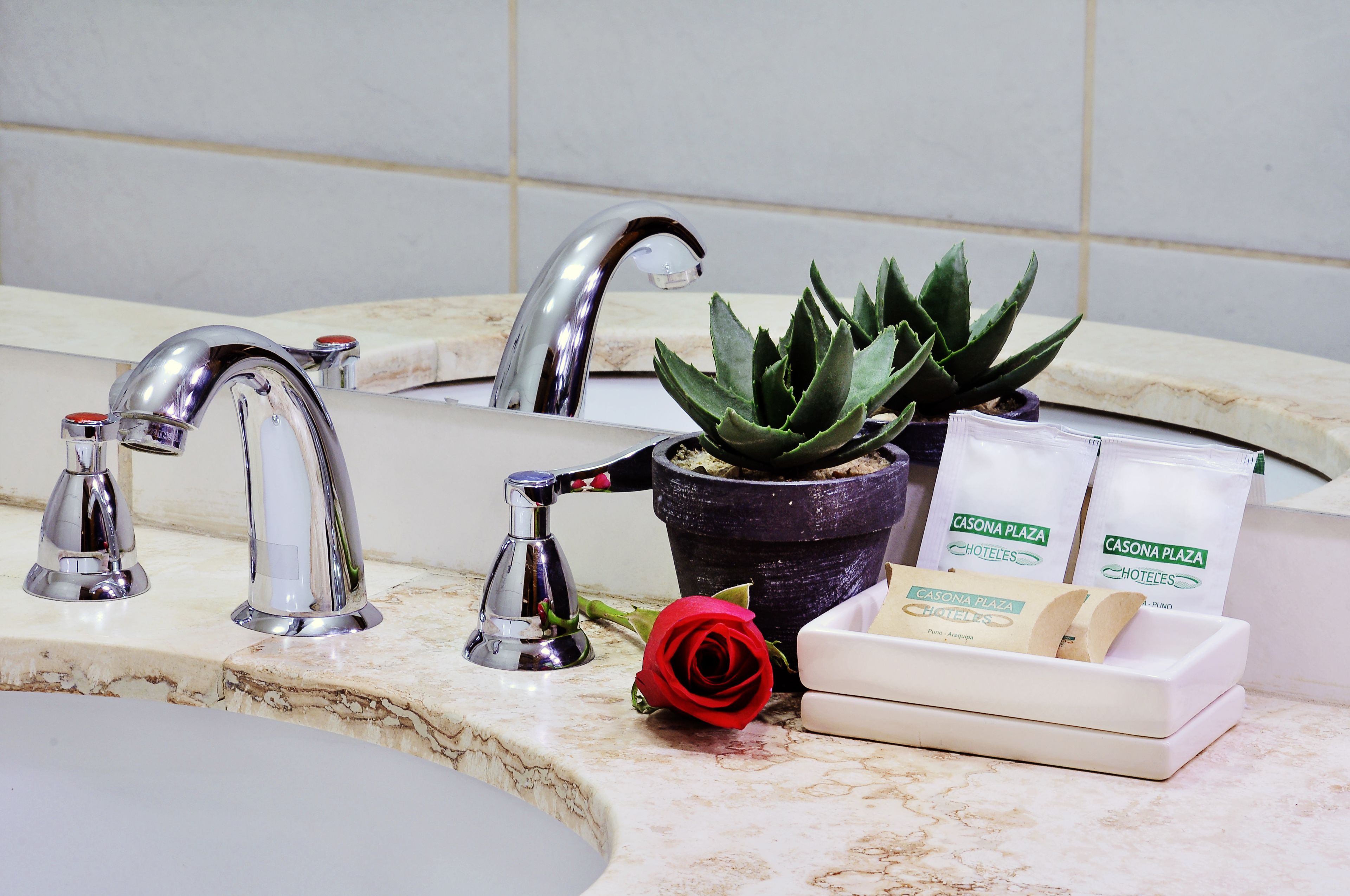 combined shower/bathtub, designer toiletries, hair dryer, towels