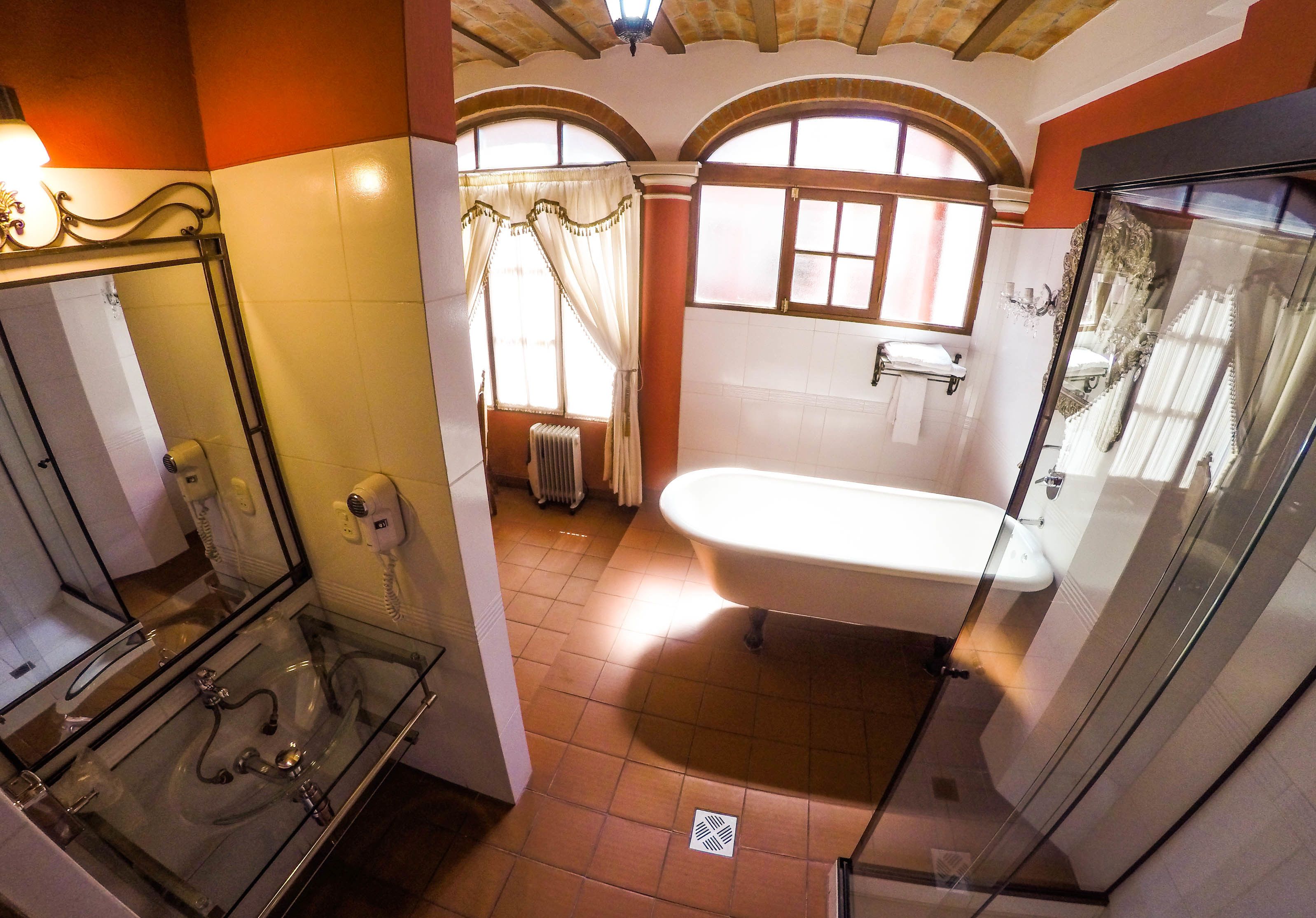luxury suite | bathroom | combined shower/bathtub, free toiletries, hair dryer, towels