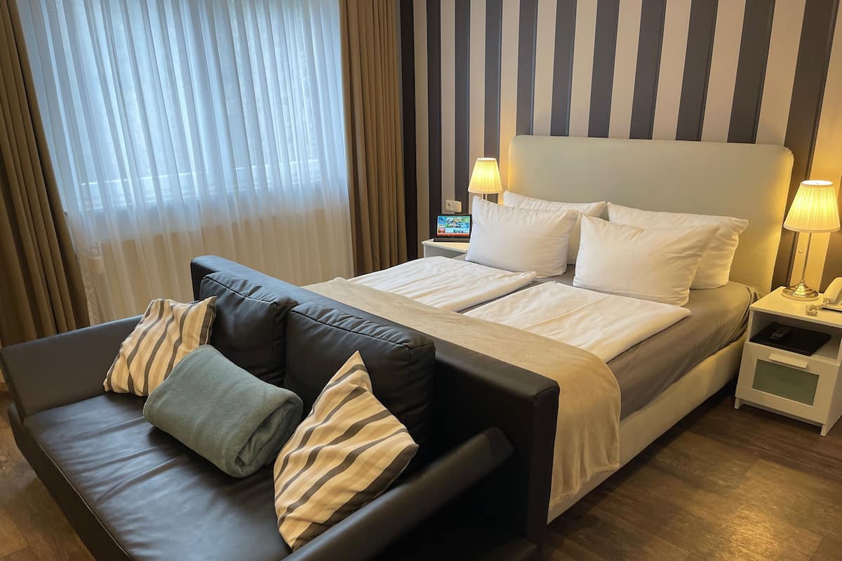 Habitación Premium | Ropa de cama de alta calidad, cortinas opacas, sistema de insonorización
