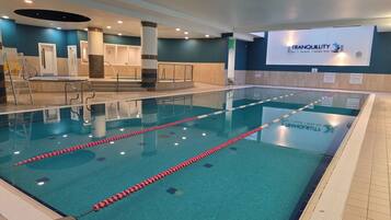 Indoor pool, open 6:00 AM to 10:00 PM, lifeguards on site