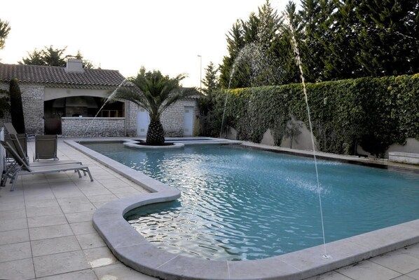 Seasonal outdoor pool, pool umbrellas, pool loungers