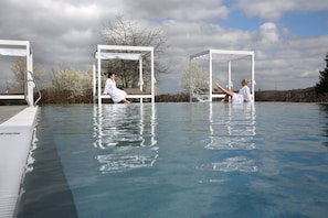 Outdoor pool, open 11:00 AM to 8:00 PM, pool umbrellas, pool loungers