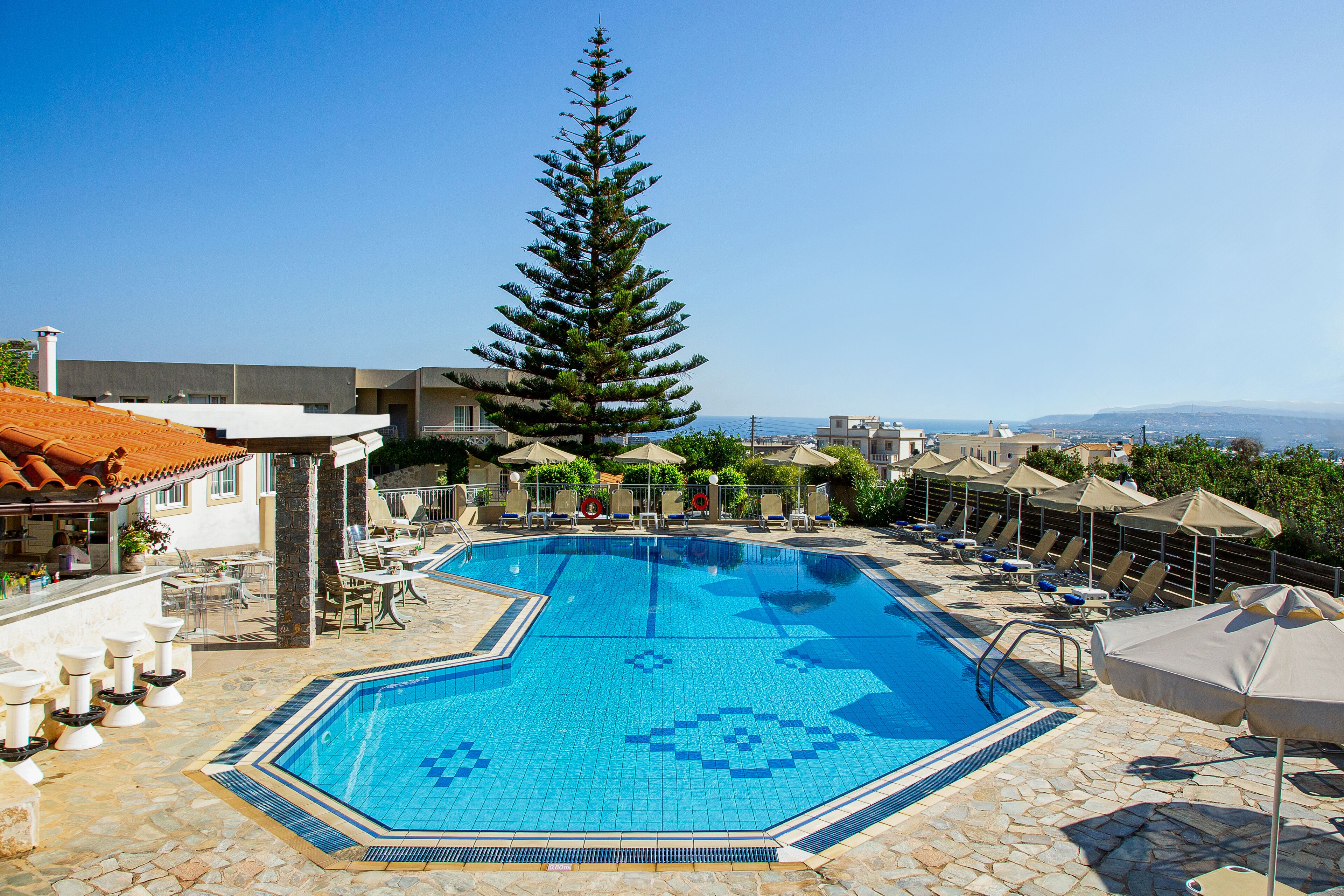 Seasonal outdoor pool, open 9:00 AM to 8:00 PM, pool umbrellas