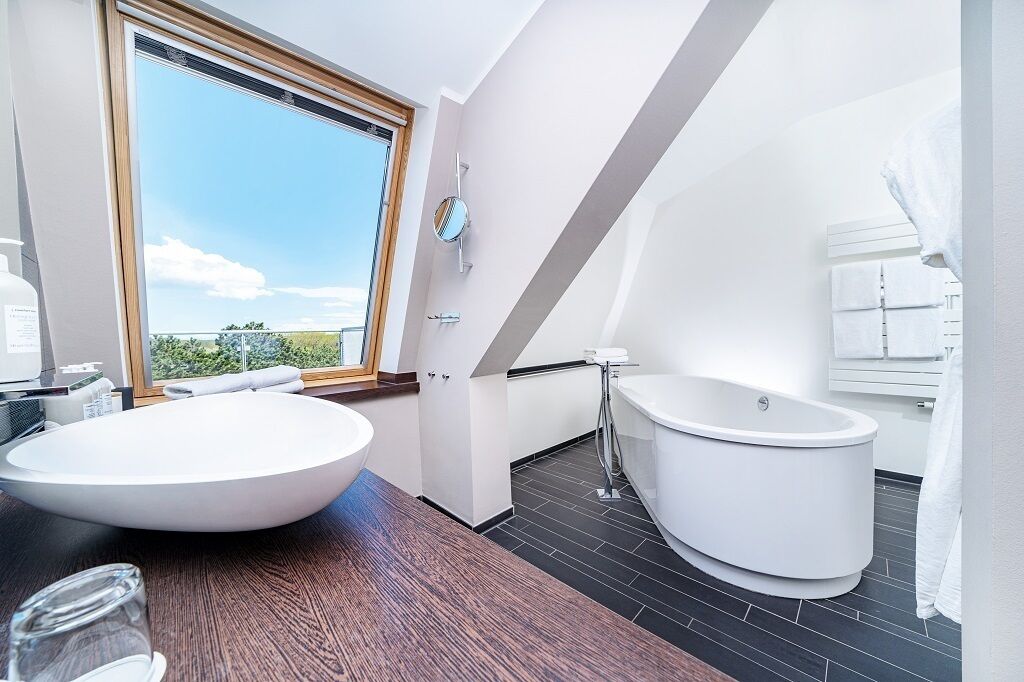 luxury studio suite | bathroom | free toiletries, hair dryer, bathrobes, slippers