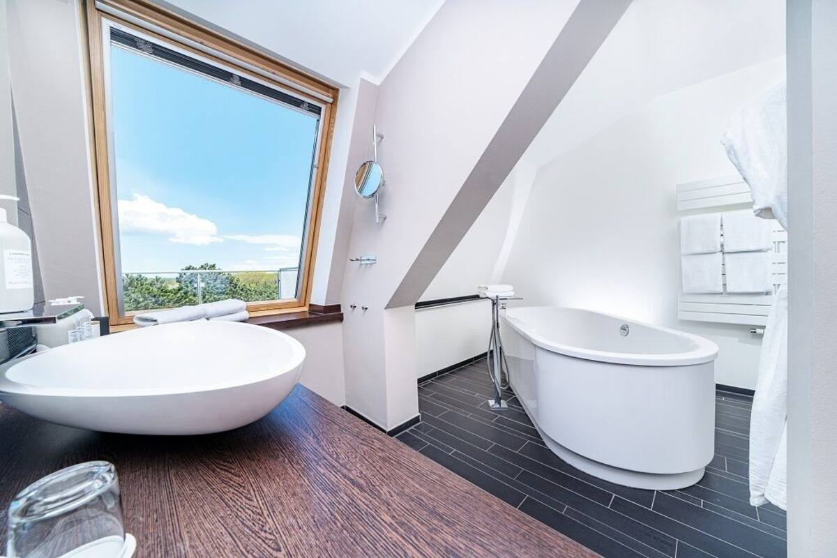 luxury studio suite | bathroom | free toiletries, hair dryer, bathrobes, slippers