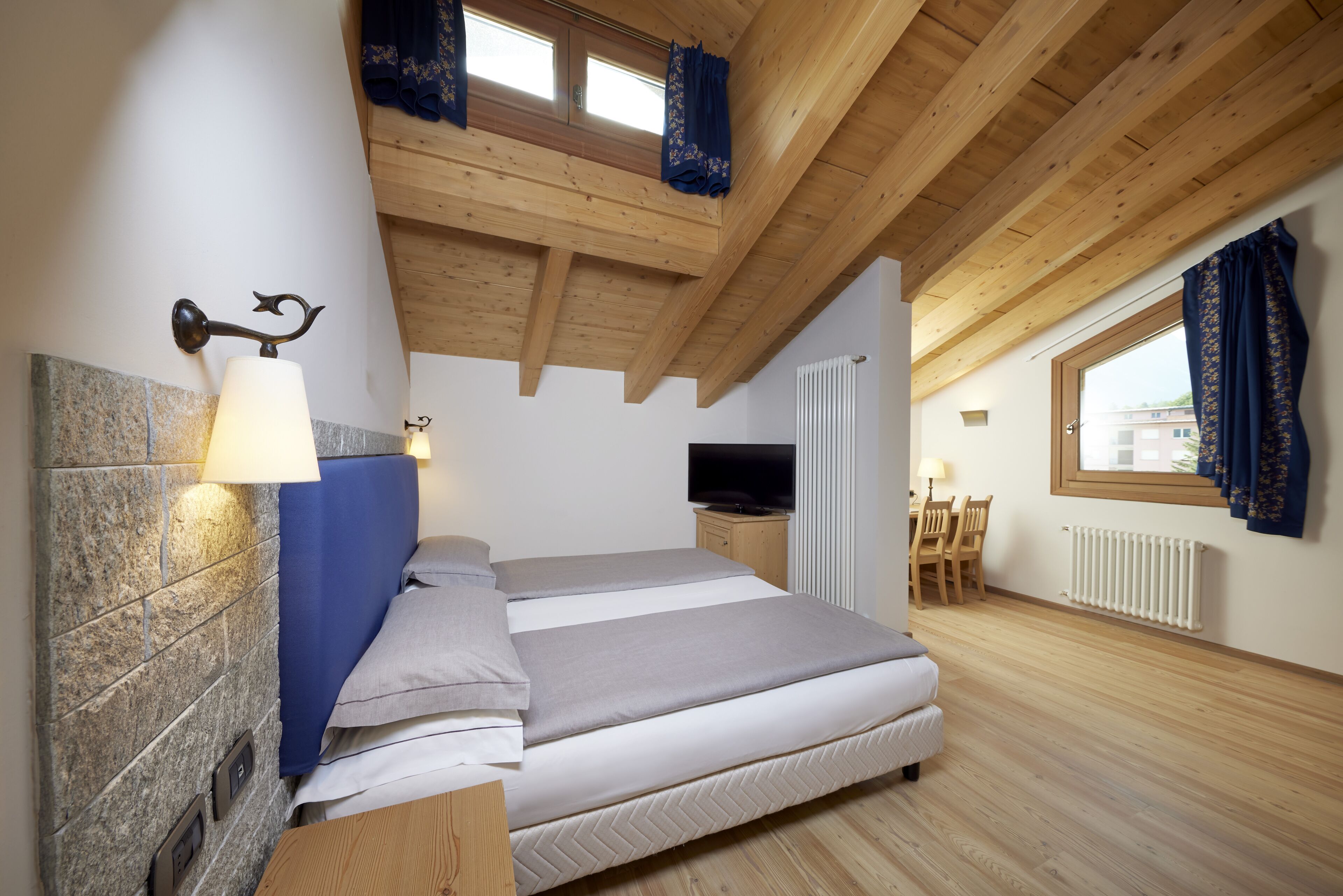 family room | 1 bedroom, minibar, in-room safe, desk