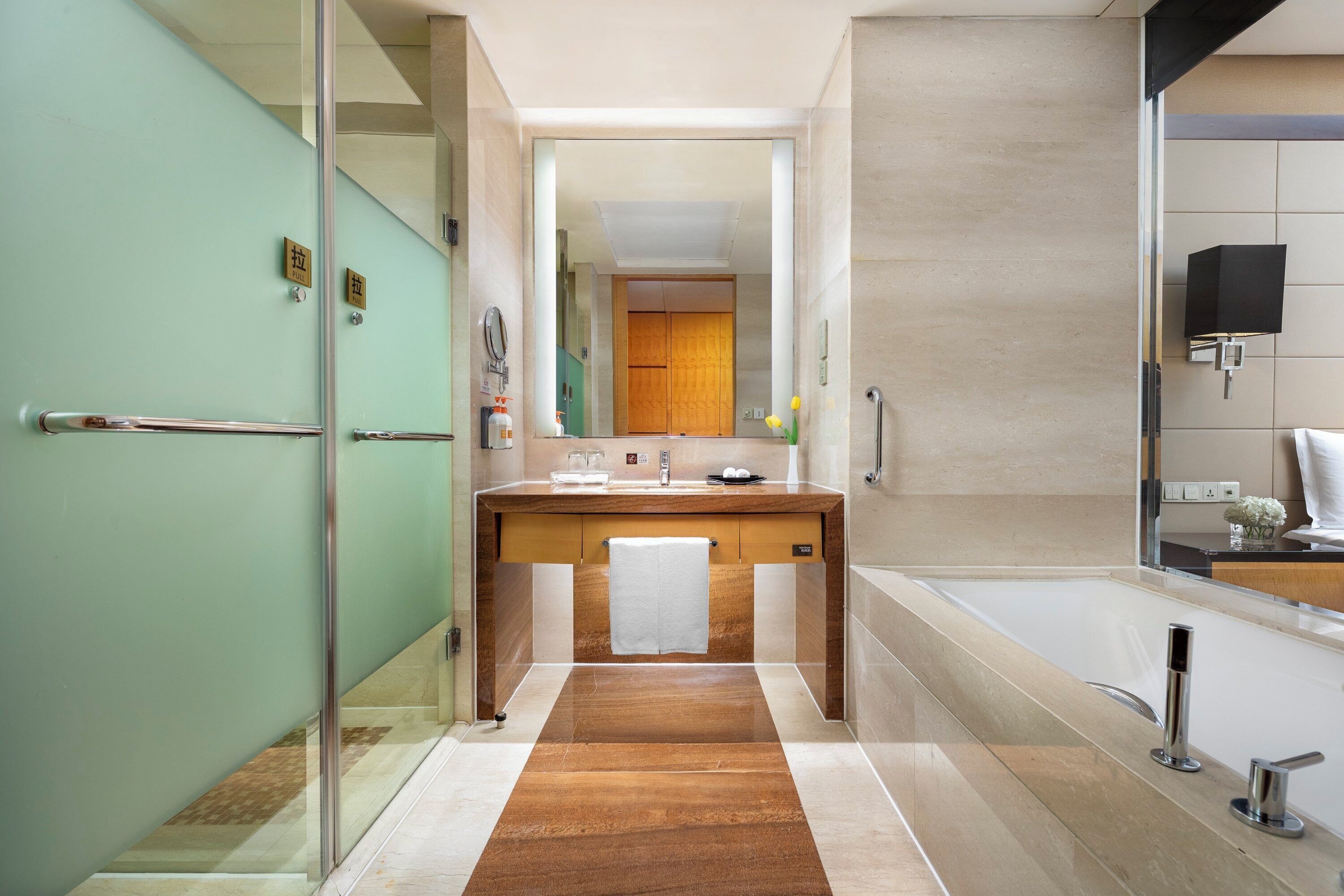 Separate tub and shower, rainfall showerhead, free toiletries